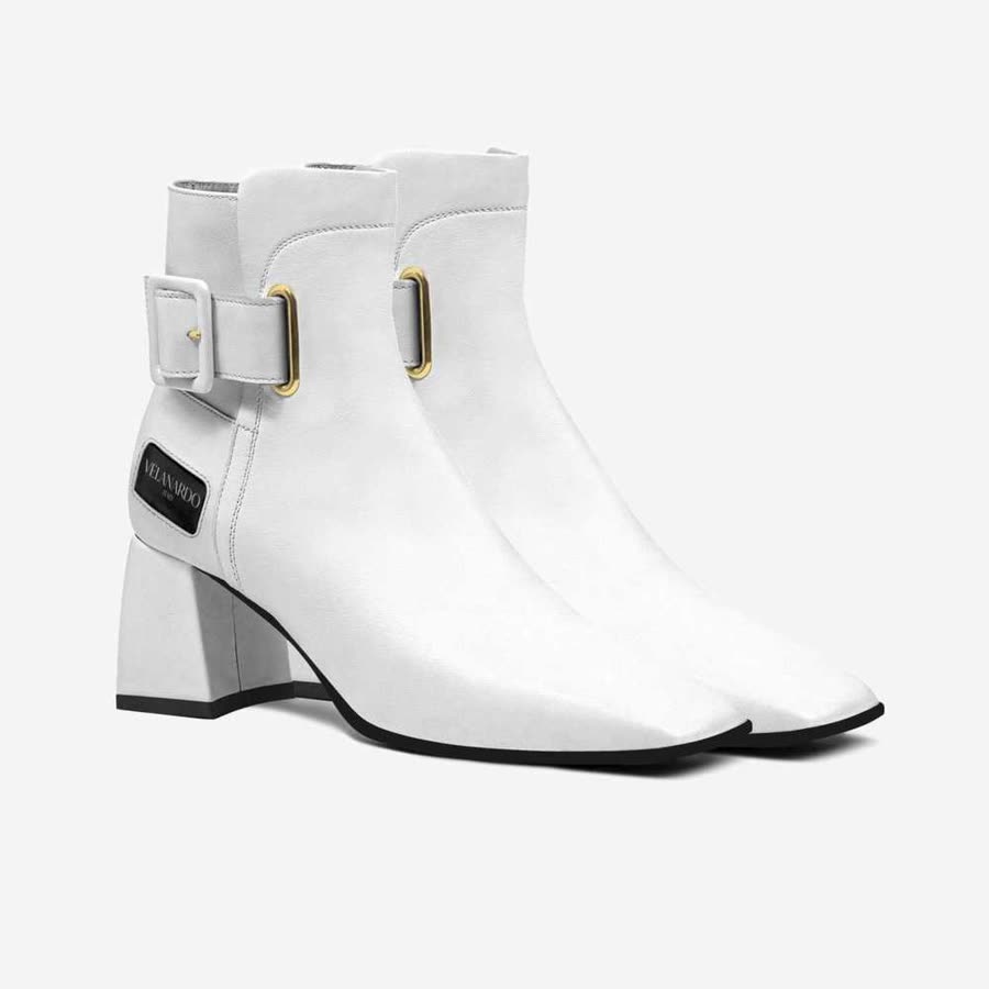 The Velanardo listing photo: a white Bianca ankle boot in profile, the square buckle fastened at the ankle.